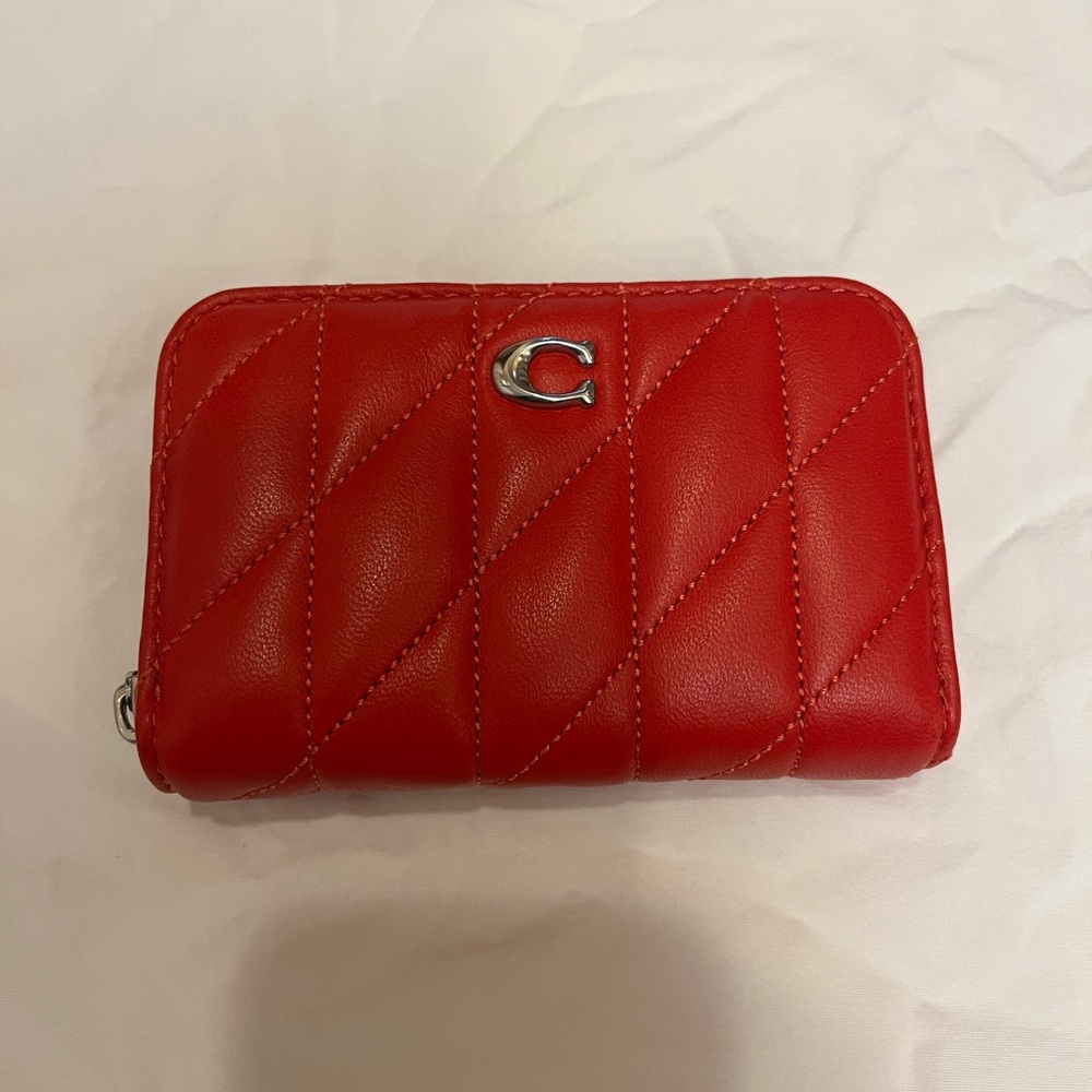 Coach quilted card case in the color red with silver hardware